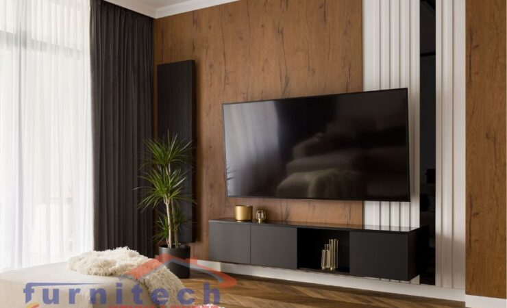 Inside a home in one of our client's house with a well-lit home Tv wall design, with clean, modest and modern design at Nairobi Kenya