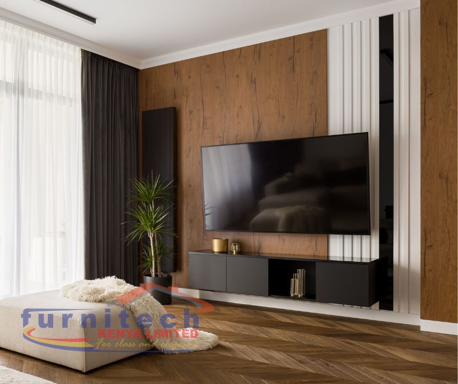 Inside a home in one of our client's house with a well-lit home Tv wall design, with clean, modest and modern design at Nairobi Kenya