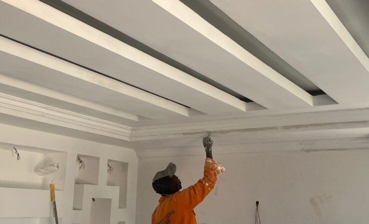 Man painting a ceiling. Cheap Painting Services. Painting Services Expert