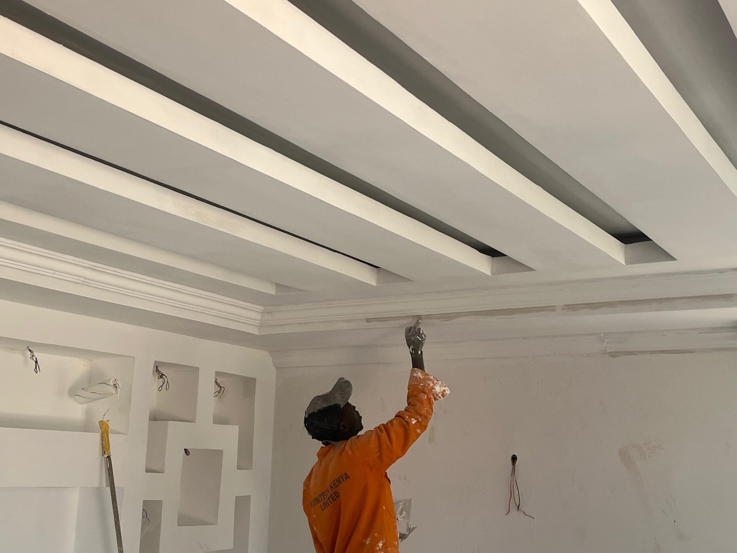 Man painting a ceiling. Cheap Painting Services. Painting Services Expert