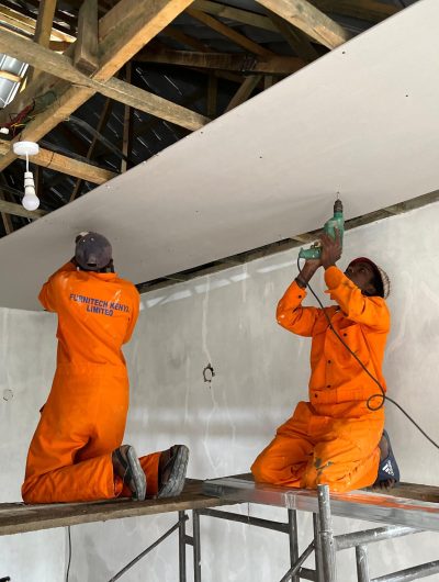 Men installing a ceiling in Kenya
