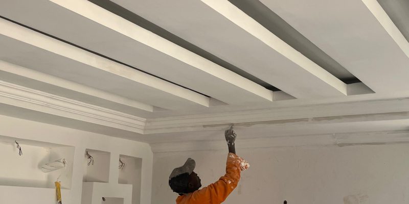Man painting a ceiling. Cheap Painting Services. Painting Services Expert